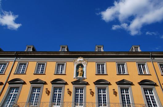 University of Bonn in Germany on background of blue sky with clouds