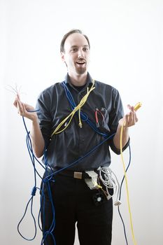 Dumb technician surprise by wires in his hand