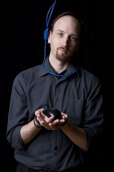 Computer technician with tied hands and hangman noeuce around his neck