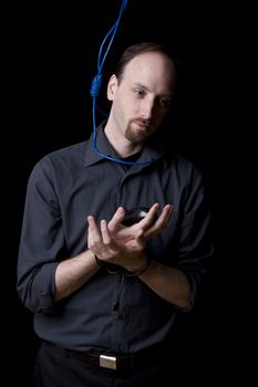 Computer technician with tied hands and hangman noeuce around his neck