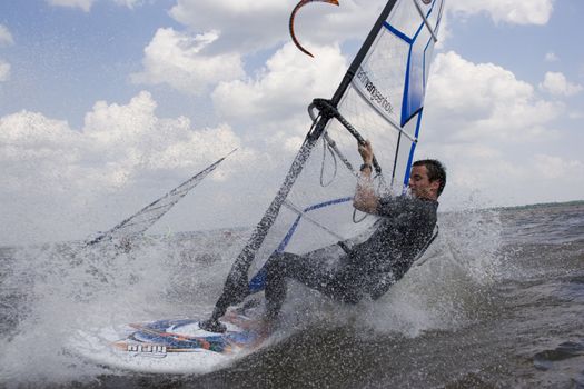 Up close view of a windsurfer at high speed