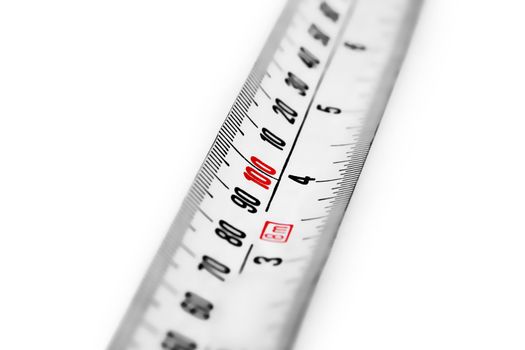 Macro shot of a tape measure against white