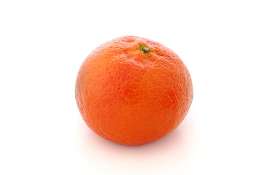 A whole ripe mandarine against white