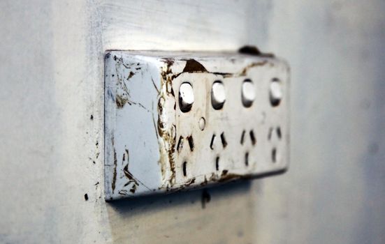 A damaged wall mounted power board