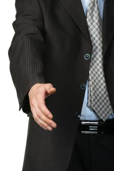 Businessman stretching out hand.Focus on hand, suit and tie blurred in background