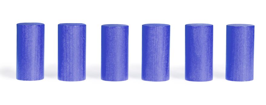 Wooden colour cylinders. It is isolated on a white background