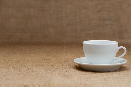 Empty white coffee cup. Grunge background