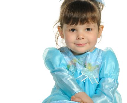 Pretty the little girl in a blue dress. It is isolated on a white background