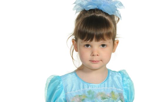 Pretty the little girl in a blue dress. It is isolated on a white background