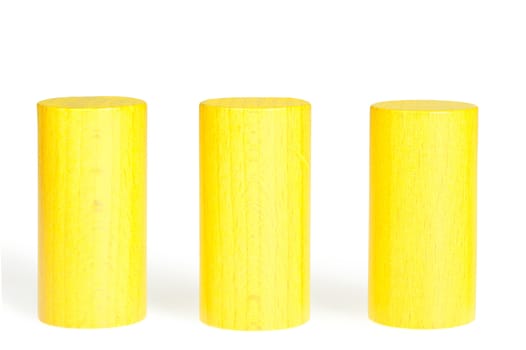 Wooden colour cylinders. It is isolated on a white background