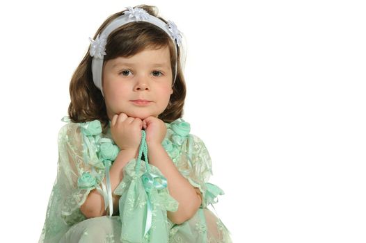 The lovely little girl close up. It is isolated on a white background