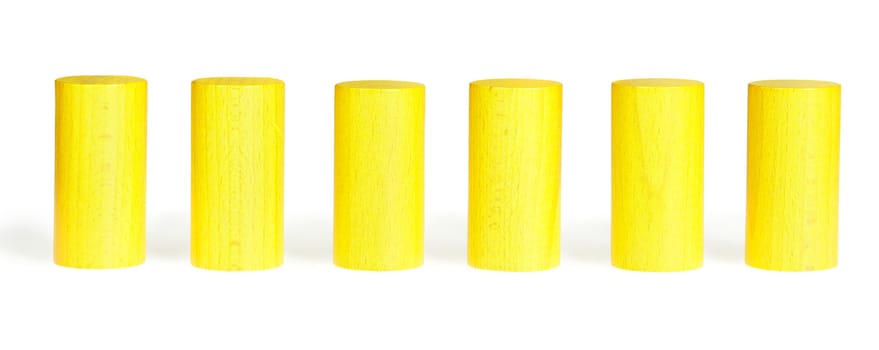 Wooden colour cylinders. It is isolated on a white background