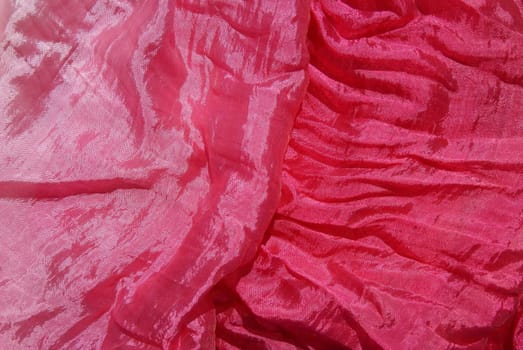 Red silk scarf is decorated and fascinates