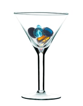 Glass for martini with colour glass stones. It is isolated on a white background