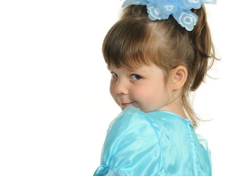 Pretty the little girl in a blue dress. It is isolated on a white background