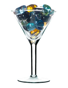 Glass for martini with colour glass stones. It is isolated on a white background