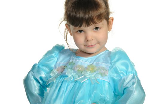 Pretty the little girl in a blue dress. It is isolated on a white background