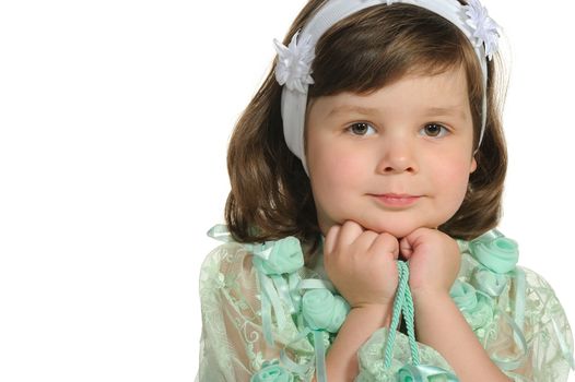 The lovely little girl close up. It is isolated on a white background