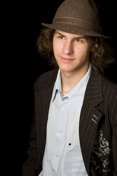 Male teenager wearing a suit and hat