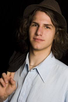 Male teenager wearing a suit and hat
