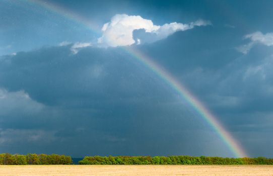 Rainbow. A landscape with a rain and a rainbow.