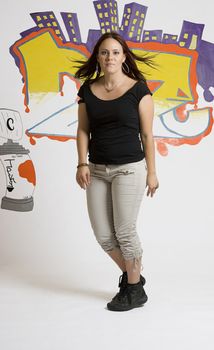 Late twenties break dancing girl at the beginning of the dance move