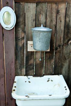 Old washstand. The adaptation for washing on a fence.