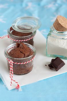 Delicious chocolate fudge cakes with piece of chocolate in little pots