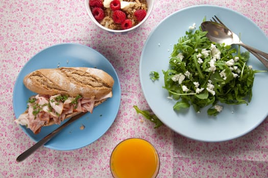 Delicious and healthy lunch with sandwich, salad and yogurt