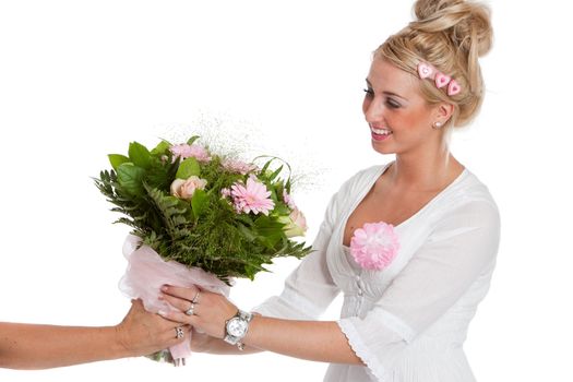 Beautiful young woman receiving a bunch of pink flowers