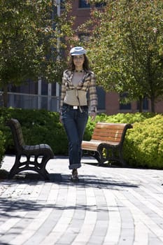 Teen girl walking in a park