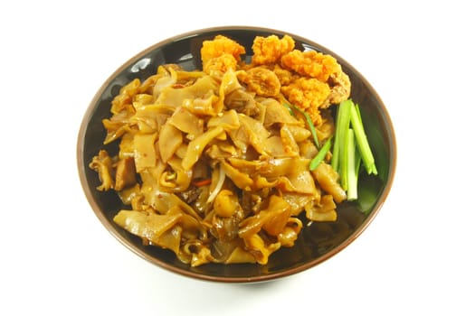 Thai Spicy Fried Noodles On a White Dish Plate