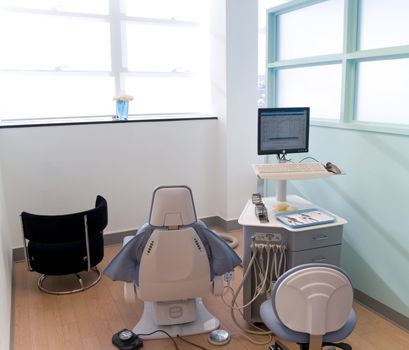 Bright dental chair and exam station.