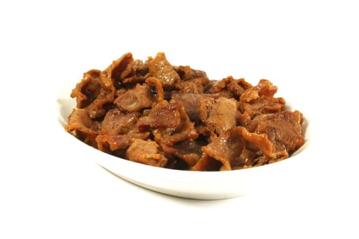 Stir Fried Pork Stips on a White Surface