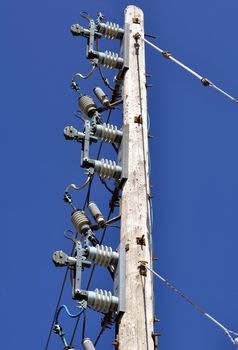 Electrical power pole with associated distribution lines and components.