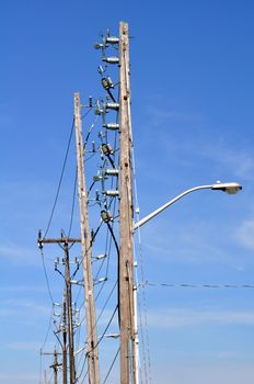 Electrical power pole with associated distribution lines and components.