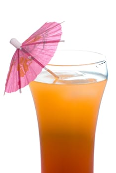 Closeup view of a tequila sunrise beverage shot with an umbrella in it, isolated against a white background