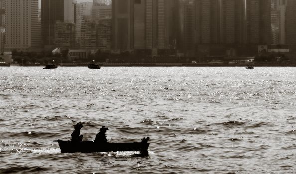 Fishing boat on Victoria harbor in Honk Kong