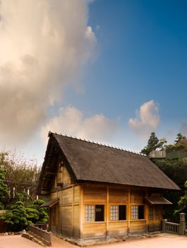 Beautiful landscape traditional Chinese wooden house under blue sky.