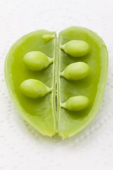 close-up fo opened green bean pod with selective focus