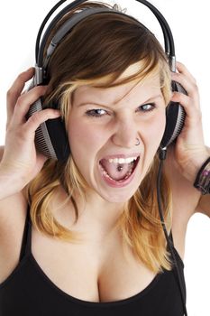 young woman screams for joy while listening to music