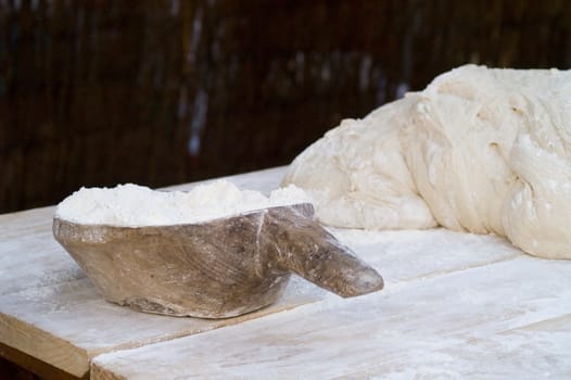 a artisan  making bread with flour