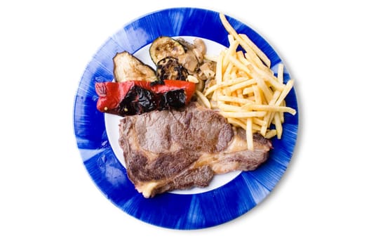 plate of steak with chips and vegetables