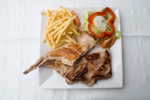 plate of steak with chips and vegetables