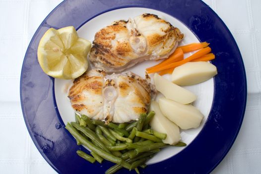 monkfish with potatoes, plate for restaurant
