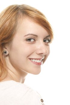 portrait of a smiling young redhead woman on white background