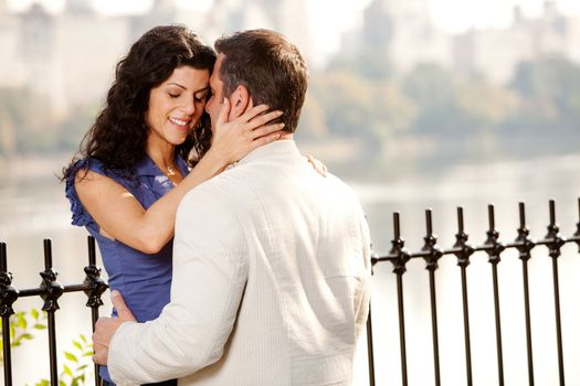 A man and woman in the park hugging