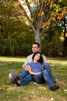 A couple relaxing, enjoying nature in a park