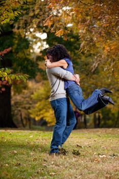 A man giving a woman a big hug - lifting her off the ground