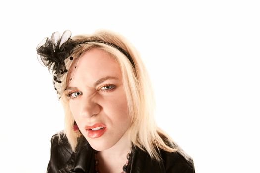 Pretty blonde woman with angry expression on her face